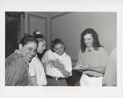 Mark Morris signing a program at a preview performance of "Dances to American Music," 1993