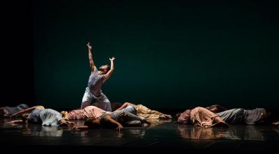 Sam Black (standing) and the company in "The," 2015